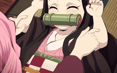Girl With Green Tube In Mouth Held By Another Girl GIF