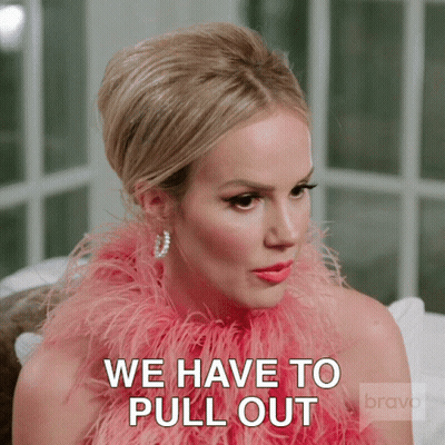 Girl With Hair Buns In Front Of Netflix Sign GIF