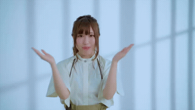 Girl With Hands On Face Looking At Camera GIF