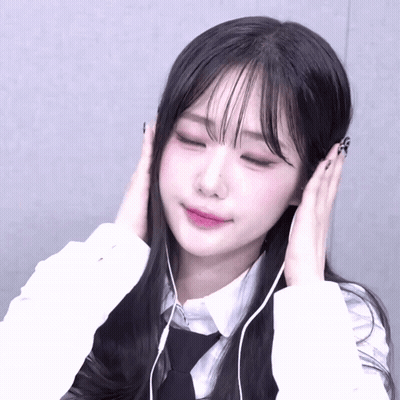Girl With Headphones Eyes Closed Hands On Ears GIF