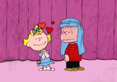 Girl With Heart On Head Next To Boy Covering Face With Pillow GIF