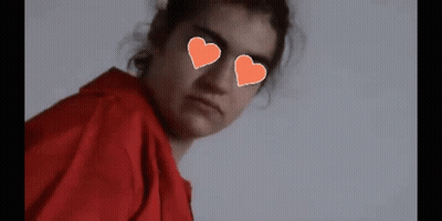Girl With Hearts In Eyes And Pixel Heart GIF