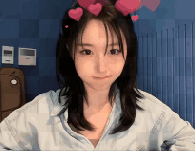 Girl With Hearts In Hair Smiling GIF