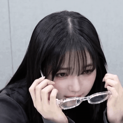 Girl With Long Black Hair And Bangs In Clear Glasses GIF