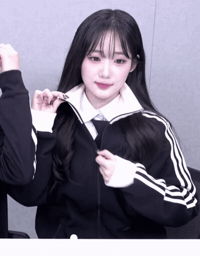 Girl With Long Black Hair In Black Jacket With White Stripes GIF