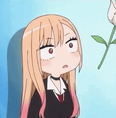 Girl With Long Blonde Hair Making Funny Face Next To Plant GIF
