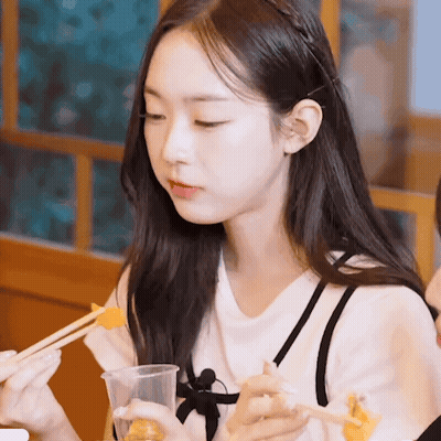 Girl With Long Hair Eating With Chopsticks GIF