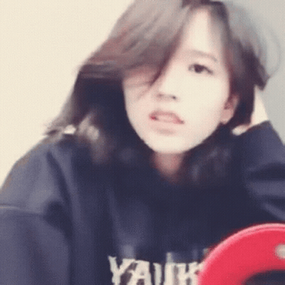 Girl With Long Hair Holding Hair GIF