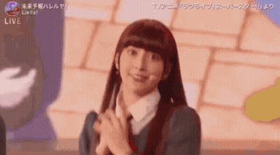 Girl With Long Hair Smiling Hands Folded GIF
