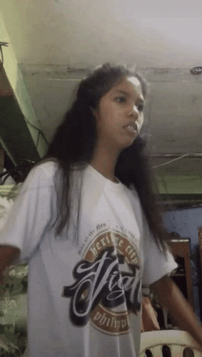 Girl With Long Hair Wearing Heritage Shirt GIF