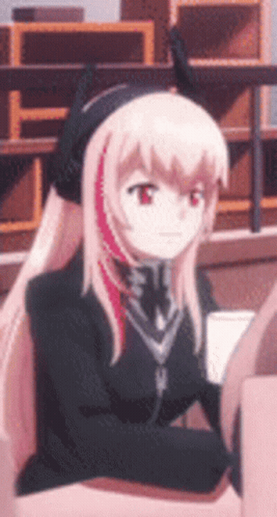 Girl With Long Pink Hair Sitting in Chair Wearing Headphones