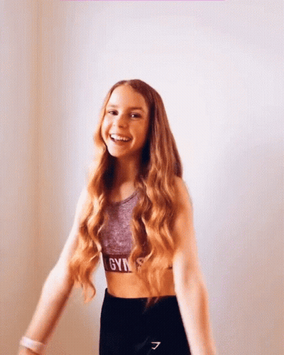 Girl With Long Red Hair In Gym Crop Top GIF