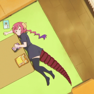 Girl With Long Tail Laying On Green Rug GIF