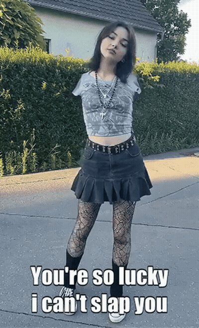 Girl With No Arm Standing On Sidewalk Saying You're So Lucky GIF