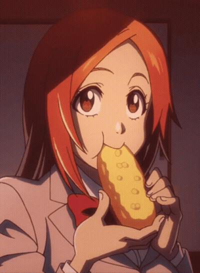 Girl With Orange Hair Eating Yellow Item GIF