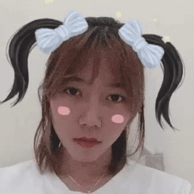 Girl With Pigtails And Bow Making Funny Face GIF