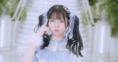Girl With Pigtails And Tiara Making Funny Face GIF