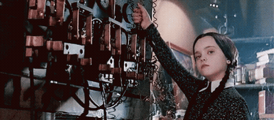Girl With Pigtails Working On Machine GIF