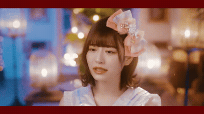 Girl With Pink Bow Looking At Camera GIF