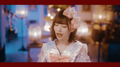 Girl With Pink Bow Looking At Camera GIF
