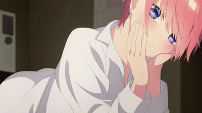 Girl With Pink Hair And Blue Eyes Laying Down With Hand On Chin GIF