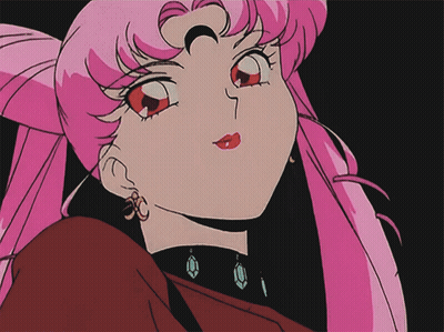 Girl With Pink Hair And Earrings Close Up GIF