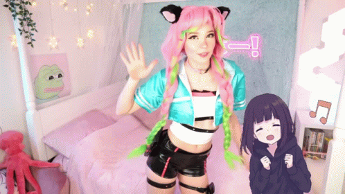 Girl With Pink Hair And Green Braids Next To Cartoon Girl GIF