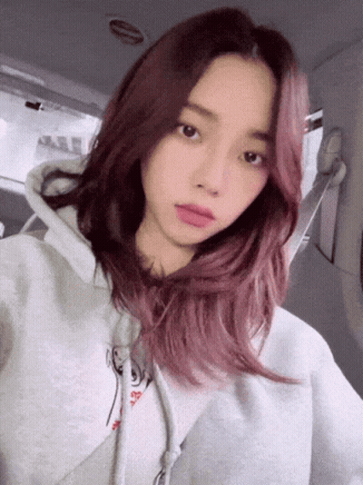 Girl With Pink Hair In Grey Hoodie Taking Selfie GIF