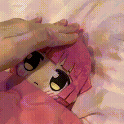 Girl With Pink Hair Lying On Bed GIF