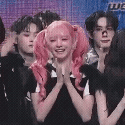 Girl With Pink Hair Pigtails On Stage GIF
