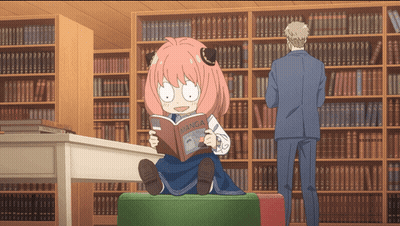 Girl With Pink Hair Reading Manga In Library GIF