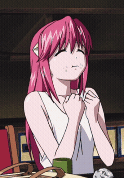 Girl with Pink Hair Sitting with Hands on Chest