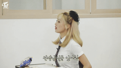 Girl With Ponytail In Classroom With Korean Writing GIF