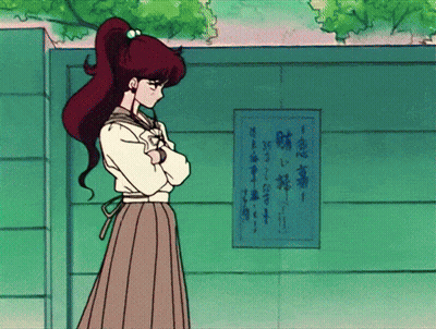 Girl With Ponytail In Front Of Sign Saying A GIF