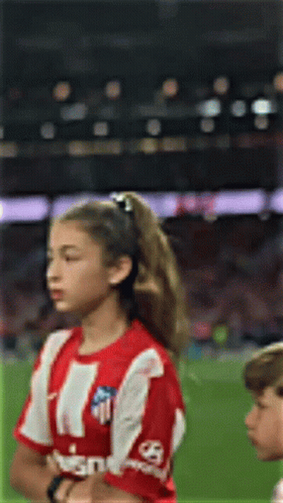 Girl With Red-And-White Striped Shirt Eyes Closed Soccer Field GIF