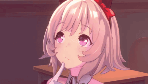 Girl With Red Bow Sitting At Desk GIF