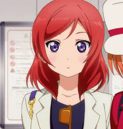 Girl With Red Hair And Purple Eyes In Sunglasses And White Jacket GIF
