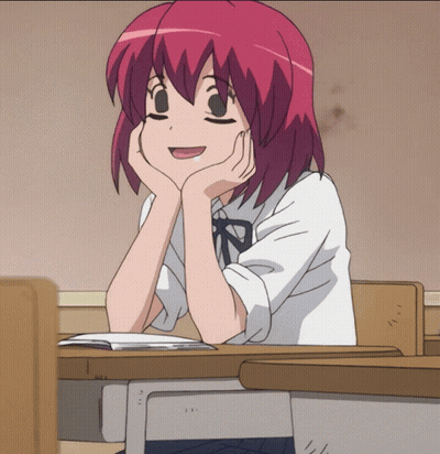 Girl With Red Hair Hands On Chin At Desk GIF