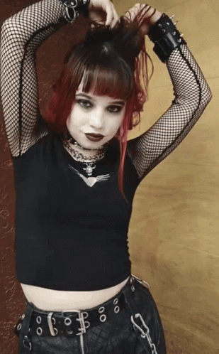 Girl With Red Hair In Black Top And Belt GIF