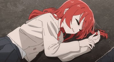 Girl With Red Hair Laying On Ground Eyes Closed GIF