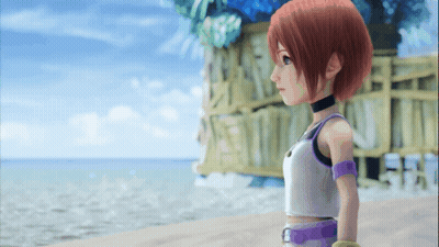 Girl With Red Hair Standing On A Beach GIF