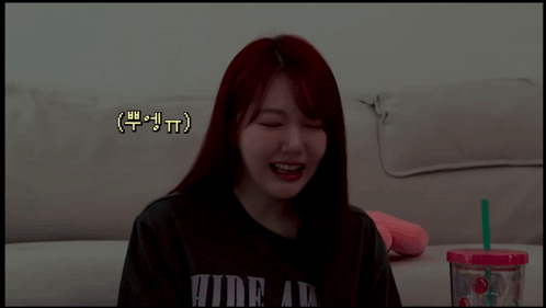 Girl With Red Hair Wearing Hide At Shirt GIF