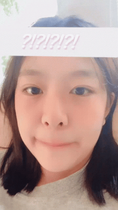 Girl With Sign Saying ? ! ? ! ? GIF