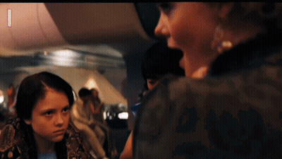 Girl With Snake Around Neck Looking At Woman GIF