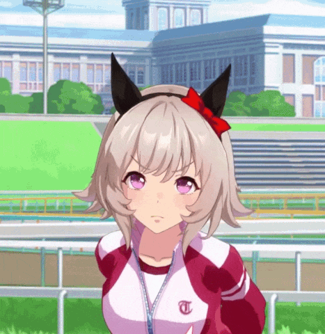Girl With T On Jacket In Front Of Large Building GIF
