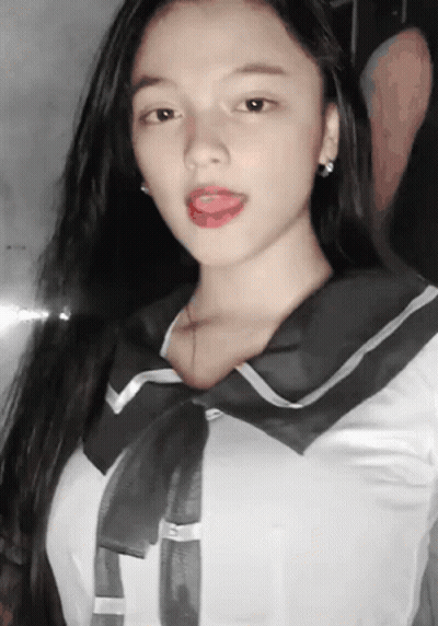 Girl With Tongue Out In Sailor Uniform GIF