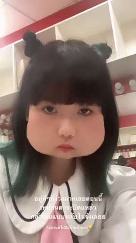 Girl With Two Buns Making Funny Face GIF