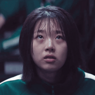 Girl With Wet Hair And Green Jacket Looking Up GIF