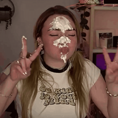 Girl With Whipped Cream On Face Giving Peace Sign GIF