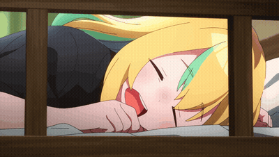Girl With Yellow Hair And Green Highlights Lying On Bed GIF